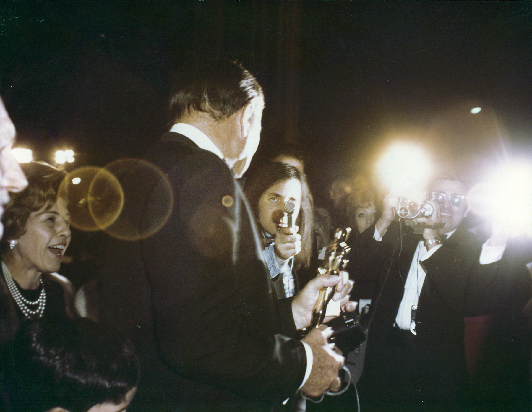 A big moment for John Wayne, but he always made time for people, including signing autographs and answering questions from press after the award ceremony.