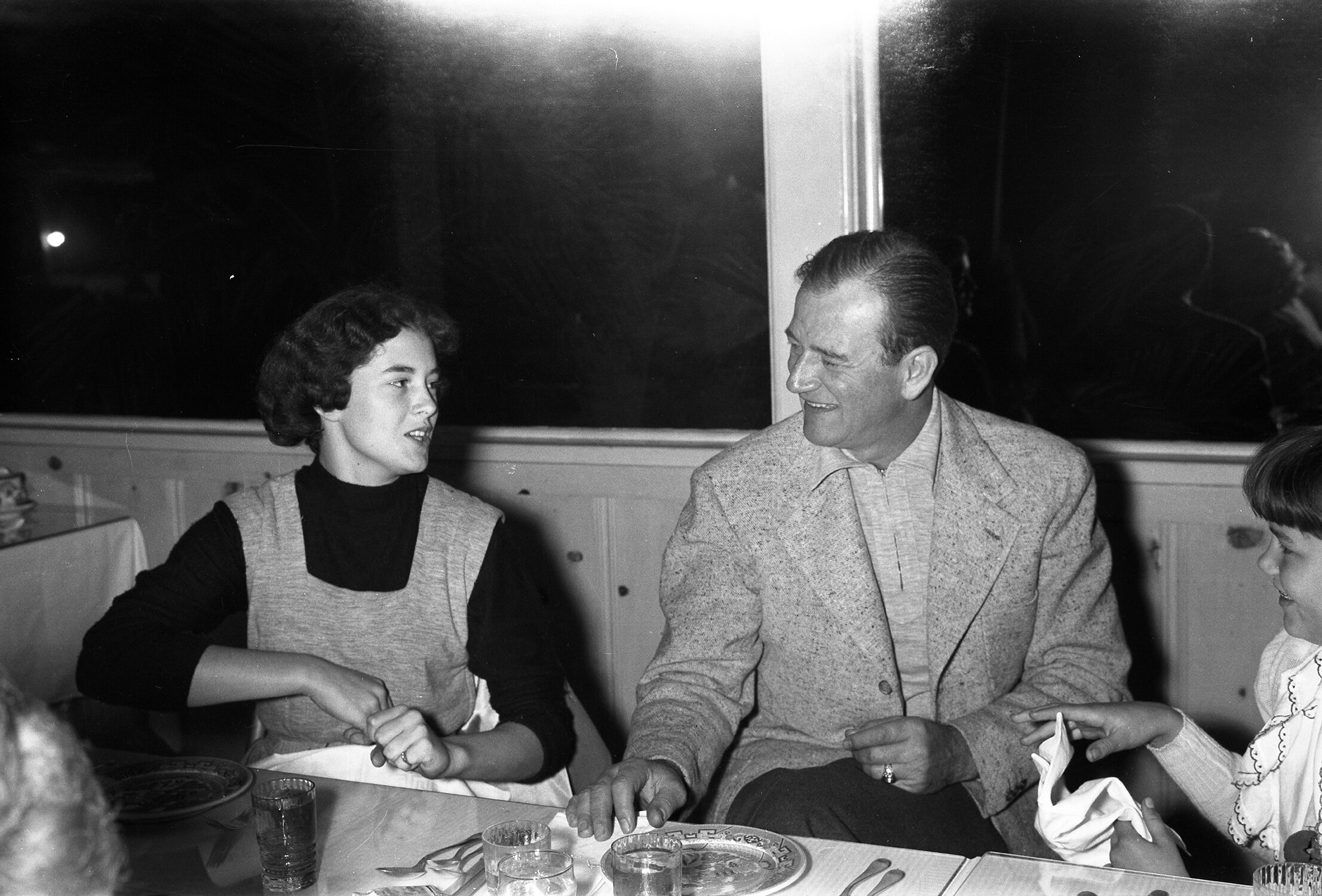 Toni (left) with her dad and sister Melinda (right) on location for the filming of Jet Pilot.