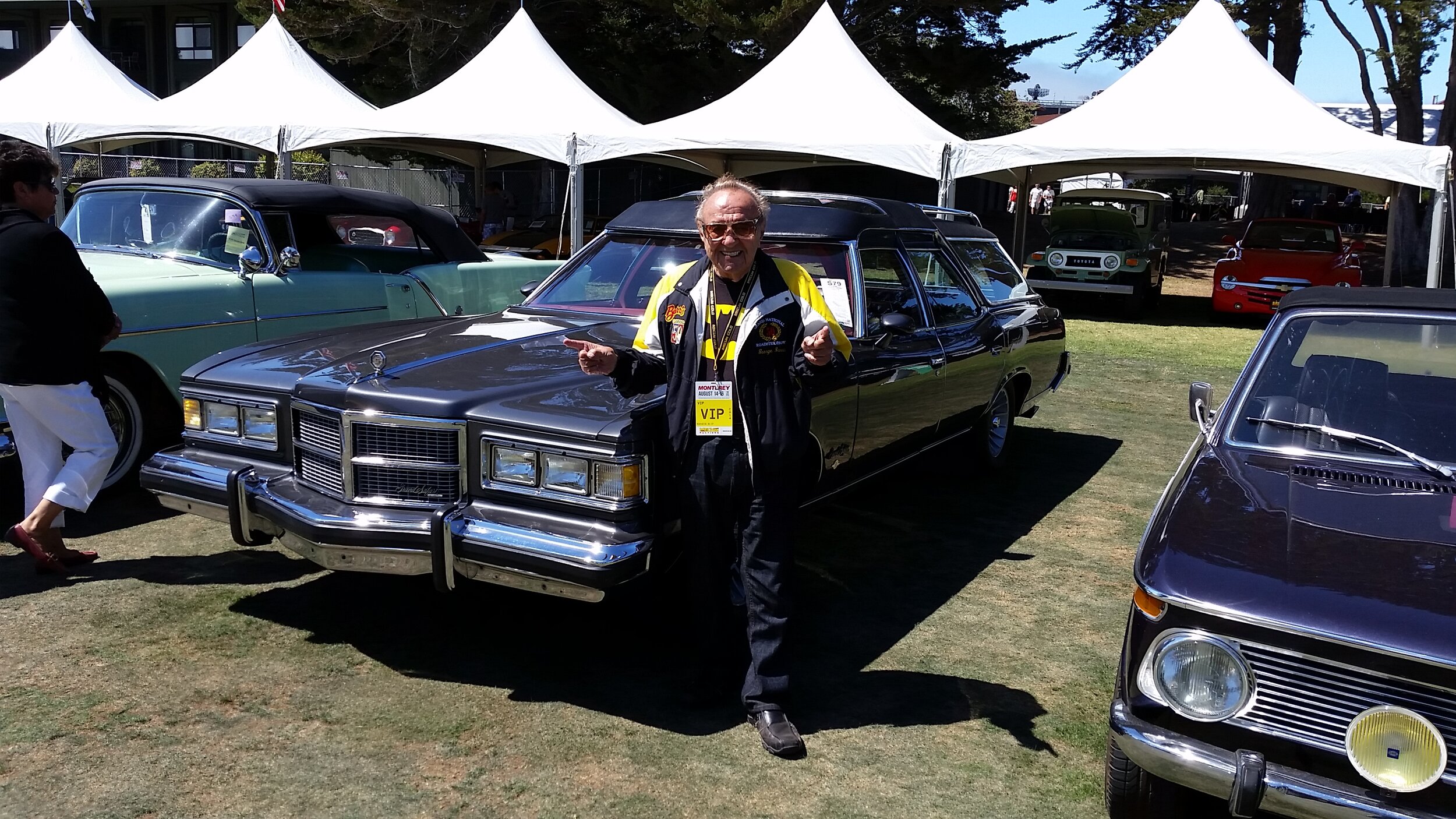 George Harris of Barris Kustom Industries next to one of John Wayne’s Station Wagons.