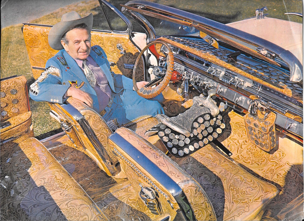 Tailor Nudie Cohn, famous designer and style icon widely known for inventing the Nudie Suit, embellishing with everything from fringe and rhinestones to feathers and pearl snap buttons.