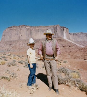 John and Ethan Wayne on the set of The Cowboys