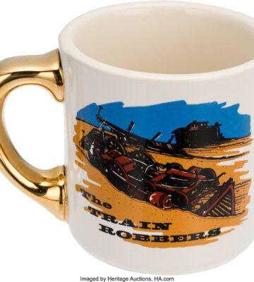 The original Gold Handle Mug from The Train Robbers (1973), gifted by John Wayne to his cast and crew. In July 2025, it sold at auction for $57,500—setting a new benchmark for Hollywood memorabilia.
