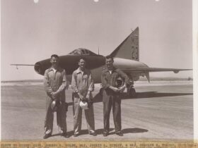 Test pilots behind the movie jet: Maj. Chuck Yeager, Capt. Joseph S. Wolfe, and Maj. Jackie L. Ridley (right to left), pose beside the mock “MiG-23” used in Jet Pilot at Edwards AFB. (U.S. Air Force / 412th Test Wing Archives)