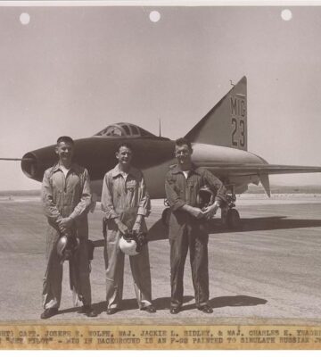Test pilots behind the movie jet: Maj. Chuck Yeager, Capt. Joseph S. Wolfe, and Maj. Jackie L. Ridley (right to left), pose beside the mock “MiG-23” used in Jet Pilot at Edwards AFB. (U.S. Air Force / 412th Test Wing Archives)